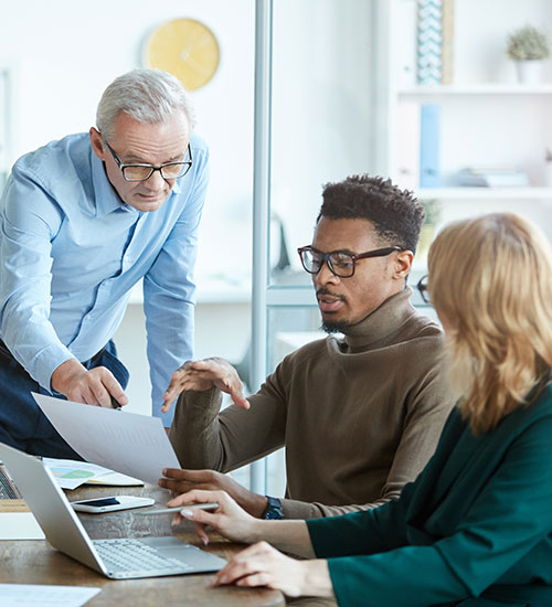 3 people in a creative meeting